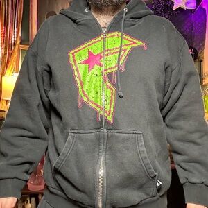 Y2K famous stars and strap Large Black Hoodie with Green and Pink Graphic